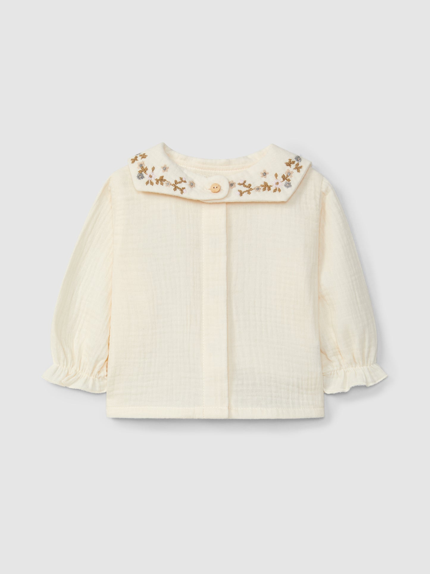 Blusa con ricamo floreale