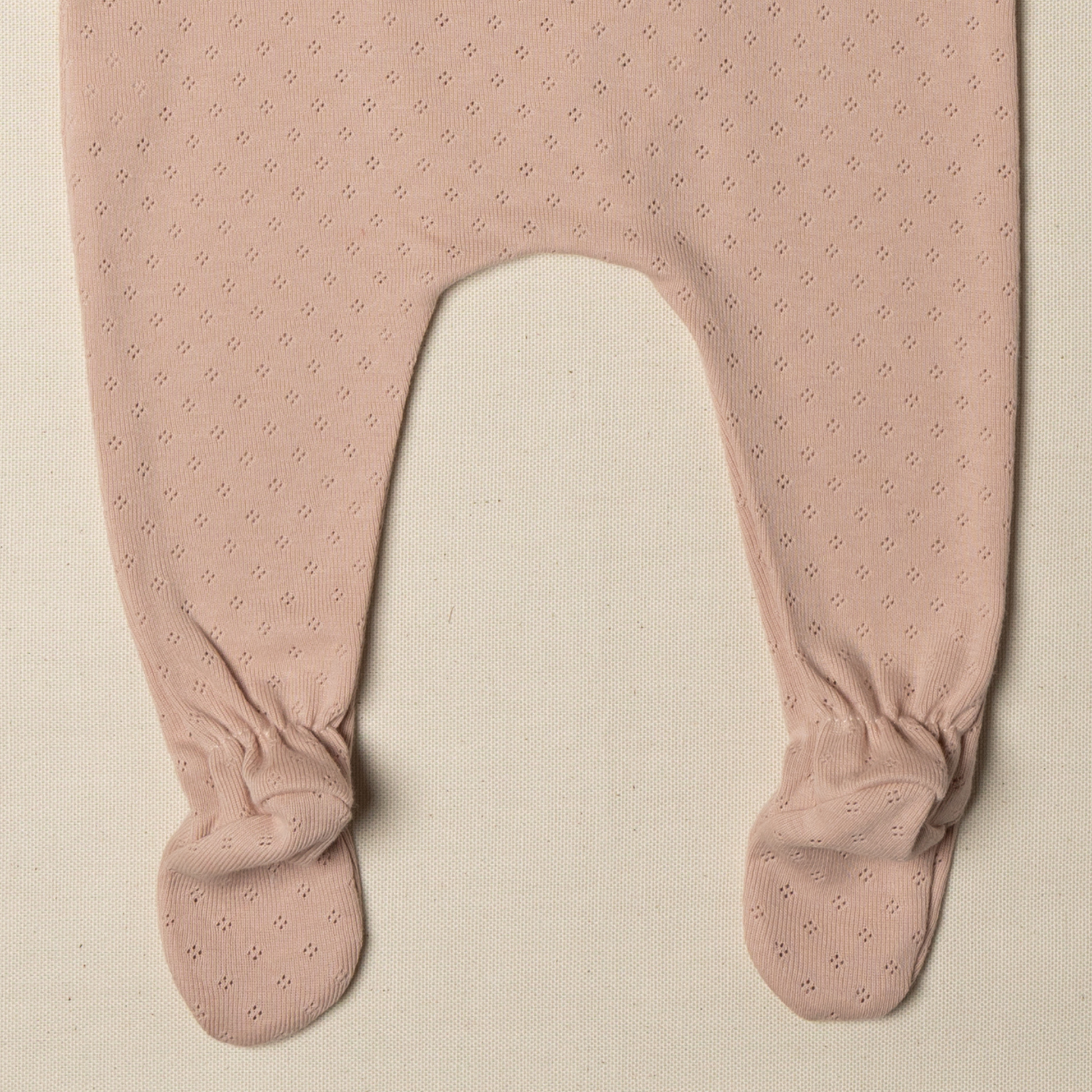 Tutina con piedino neonato