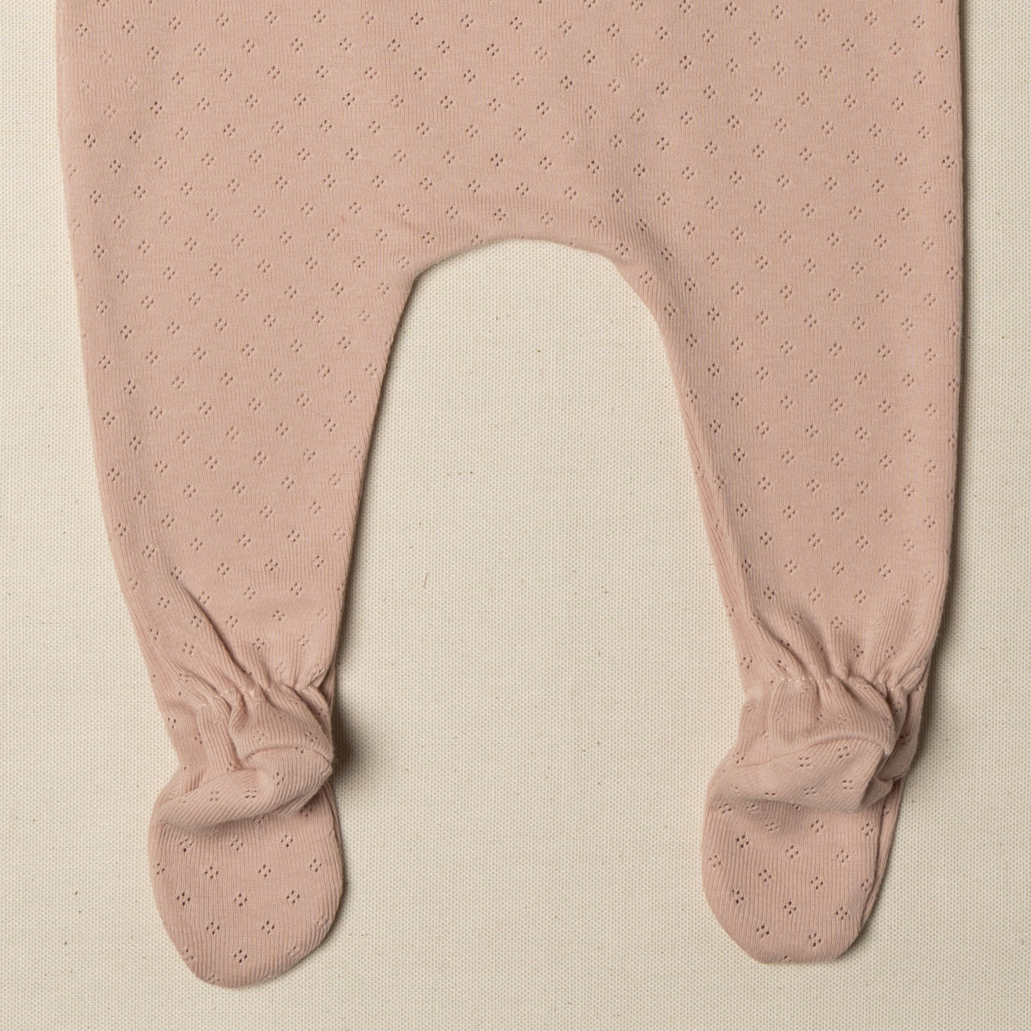 Tutina con piedino neonato